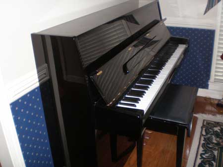 Samick console piano for rent in Lakeland Tn