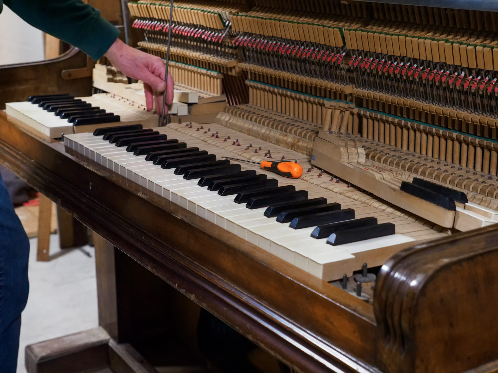Open piano with visible internal mechanics