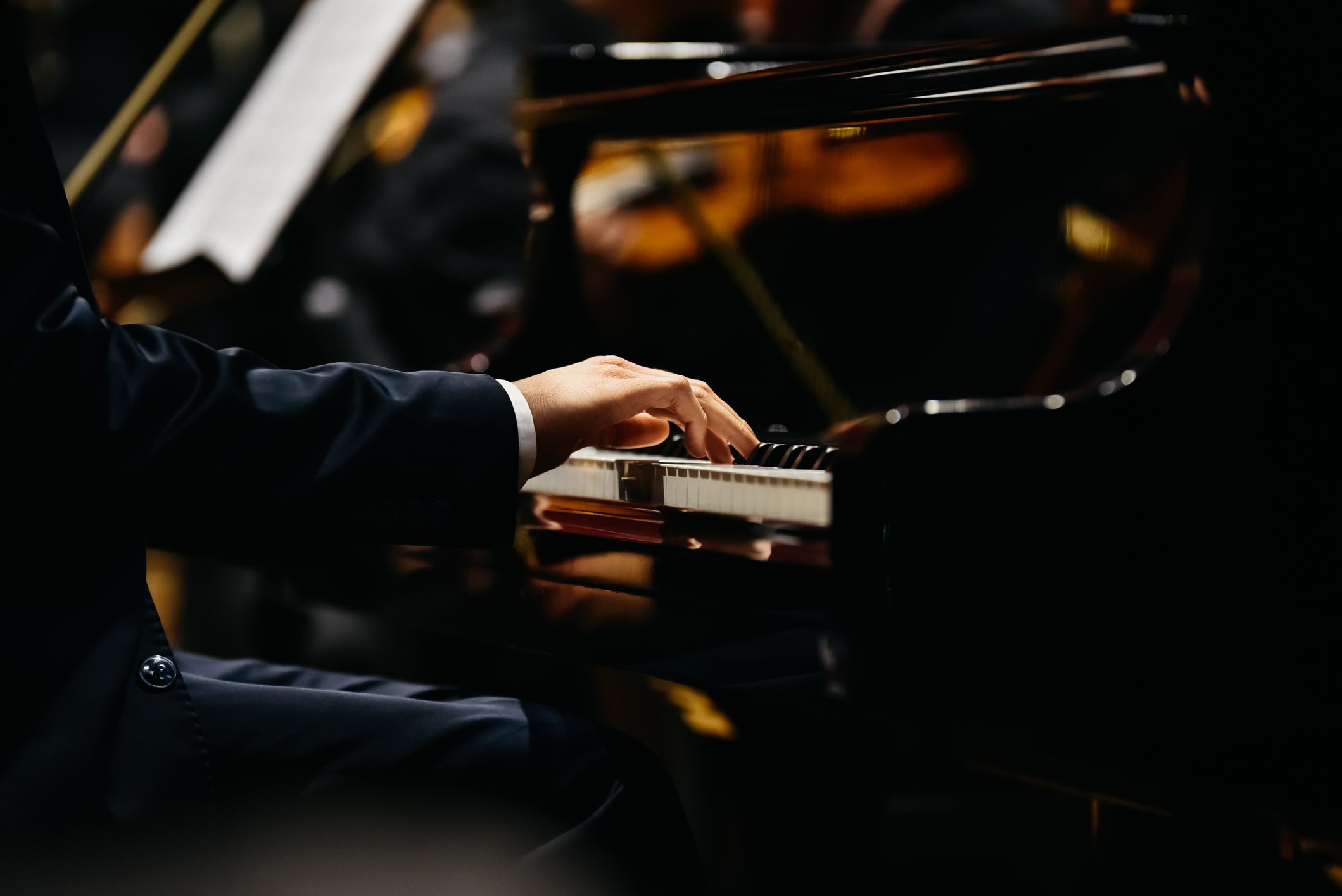 Close-up of hands playing piano