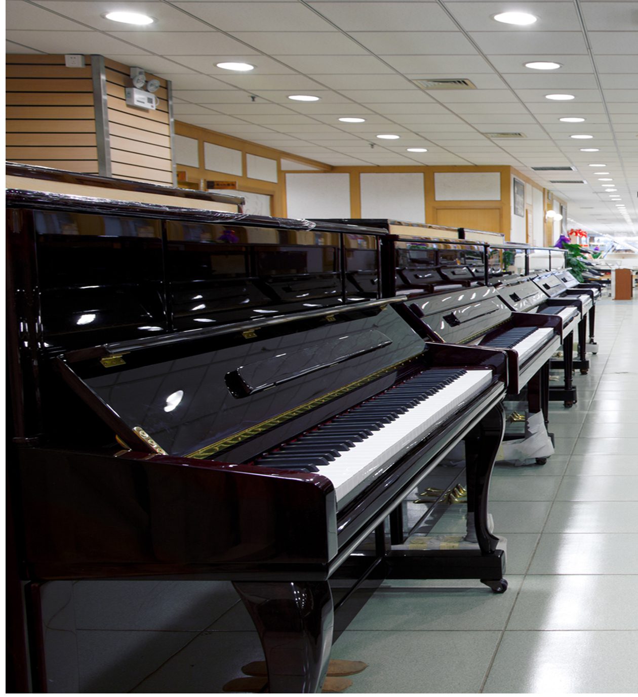 Upright pianos displayed in showroom