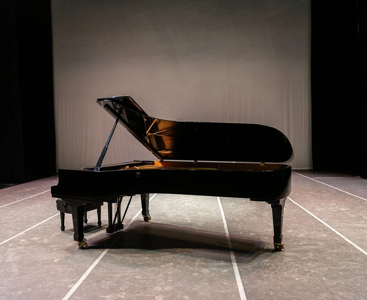 Classical grand piano in an auditorium