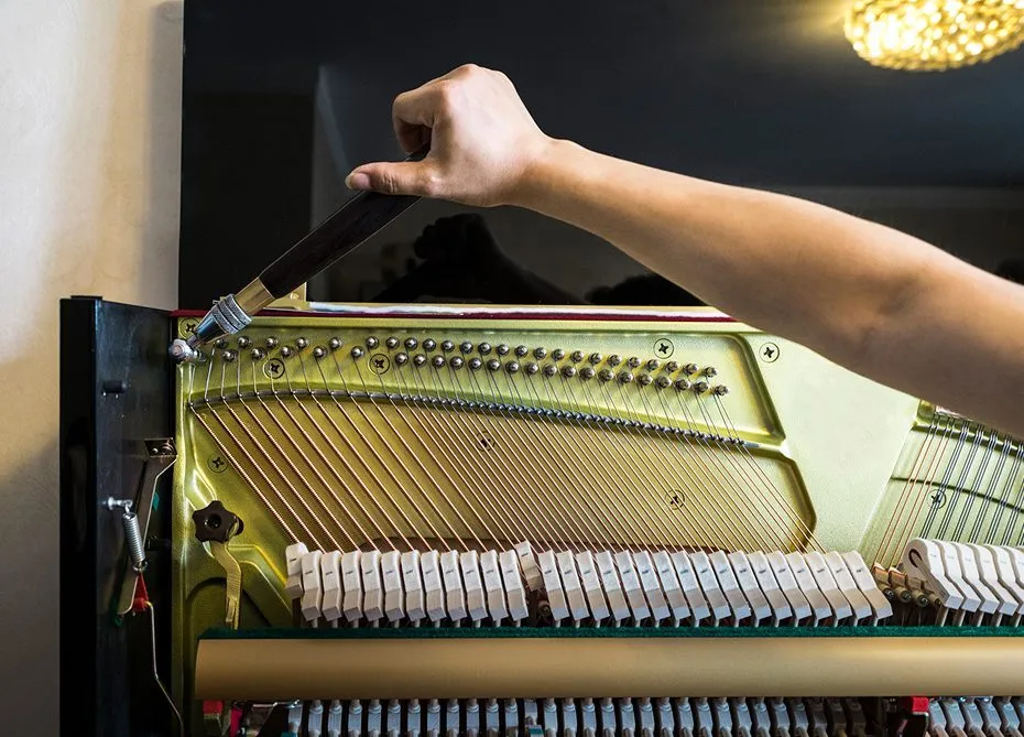 Hand tuning a piano's internal strings